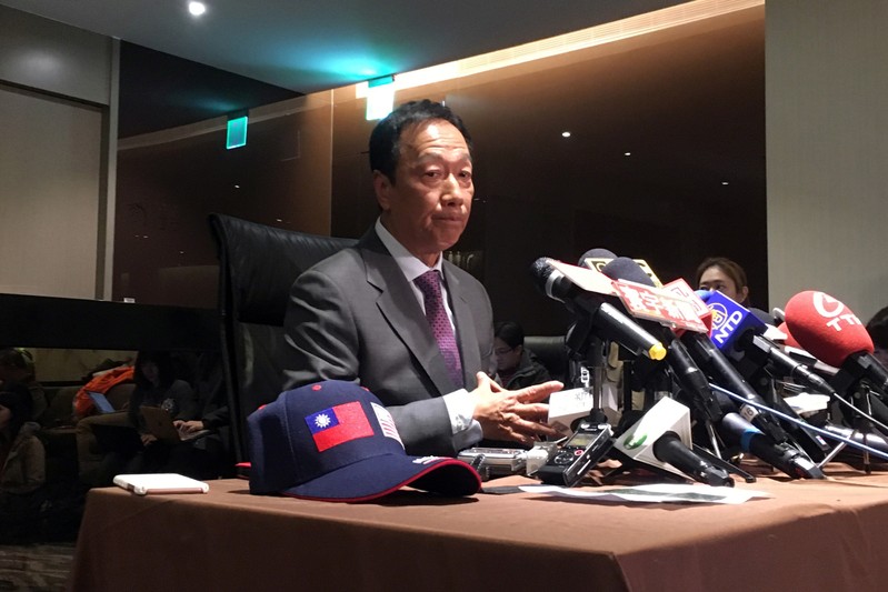 Foxconn Technology Group founder Terry Gou attends a news conference before leaving for the United States, at Taipei Songshan Airport
