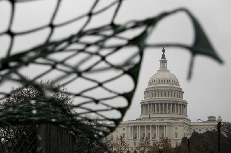 FILE PHOTO: The U.S. Capitol is seen on a rainy day in Washington