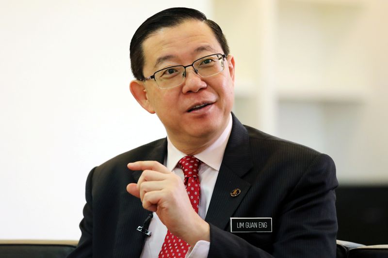 FILE PHOTO: Malaysia's Finance Minister Lim Guan Eng speaks during an interview with Reuters in Putrajaya