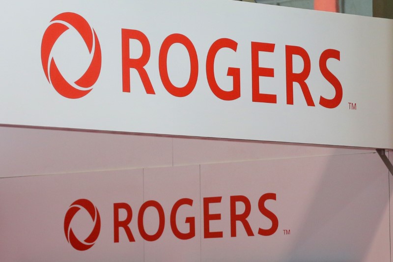 Rogers Communications logos are seen above a booth at the Canadian International AutoShow in Toronto
