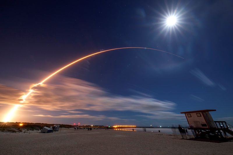 The Solar Orbiter spacecraft built for NASA and the European Space Agency lifts off from pad 41 aboard a United Launch Alliance Atlas V rocket as the full moon is seen above at the Cape Canaveral Air Force Station in Cape Canaveral