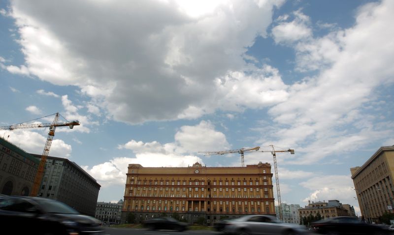 Cars drive past the headquarters of the Federal Security Service in central Moscow