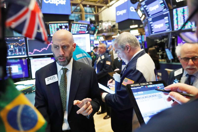 Traders work on the floor of the New York Stock Exchange shortly after the opening bell in New York