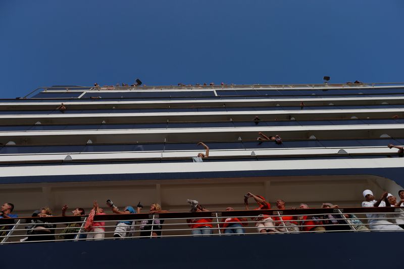 Passengers onboard MS Westerdam, a cruise ship that spent two weeks at sea after being turned away by five countries over fears that someone aboard might have the coronavirus, are seen in Sihanoukville