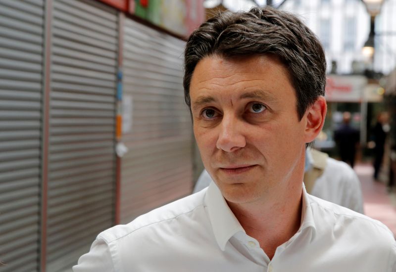 FILE PHOTO: Benjamin Griveaux, La Republique En Marche (LREM) candidate for the forthcoming Paris mayoral election, visits the Saint-Quentin Covered Market in Paris