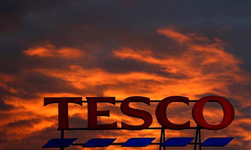 A company logo is pictured outside a Tesco supermarket in Altrincham northern England.
