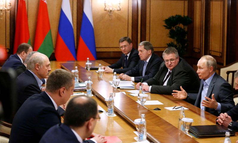FILE PHOTO: Russian President Vladimir Putin and Belarusian President Alexander Lukashenko talk during their meeting in the Black sea resort of Sochi