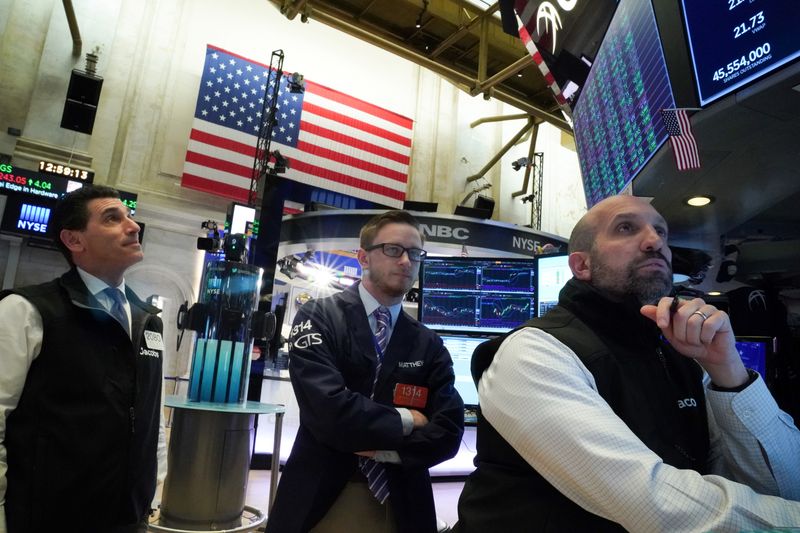 Traders work at the New York Stock Exchange