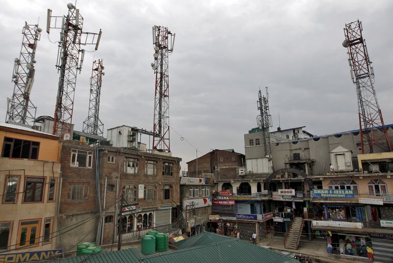 FILE PHOTO: A view of telecom towers installed over the buildings is pictured in Srinagar
