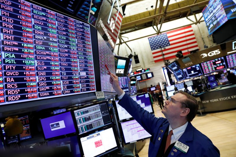 A trader works on the floor at the New York Stock Exchange (NYSE) in New York City