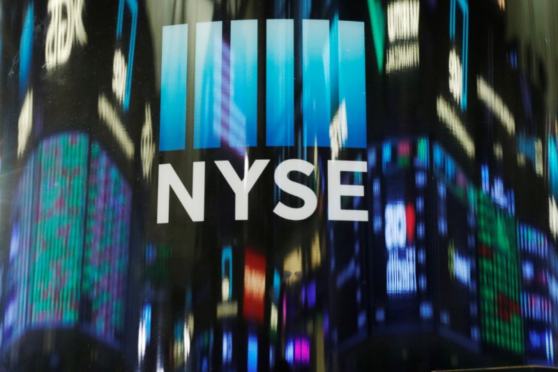 The day's numbers are reflected above the floor of NYSE shortly before the closing bell in New Yor