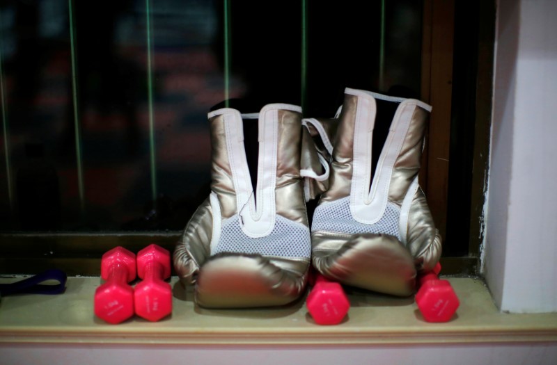 FILE PHOTO: Boxing gloves are seen by a window at Princess Women's Boxing Club in Shanghai