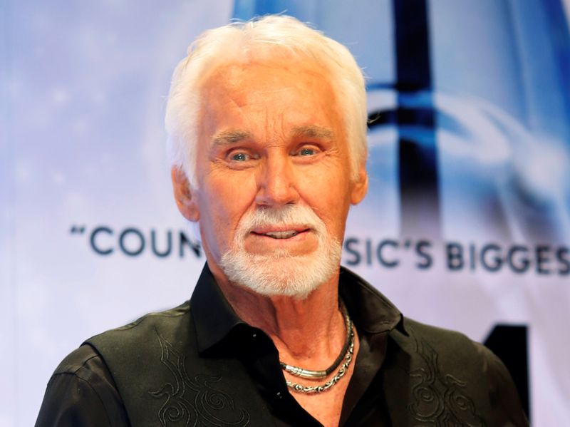 FILE PHOTO: Kenny Rogers poses backstage after accepting the Willie Nelson Lifetime Achievement award at the 47th Country Music Association Awards in Nashville