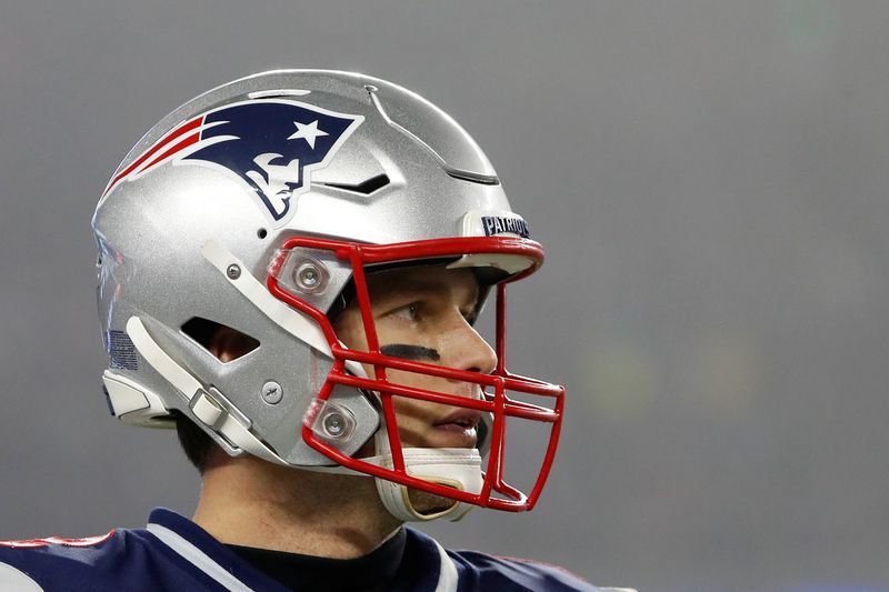 FILE PHOTO: Former New England Patriots quarterback Tom Brady (12) during a playoff game against the Tennessee Titans