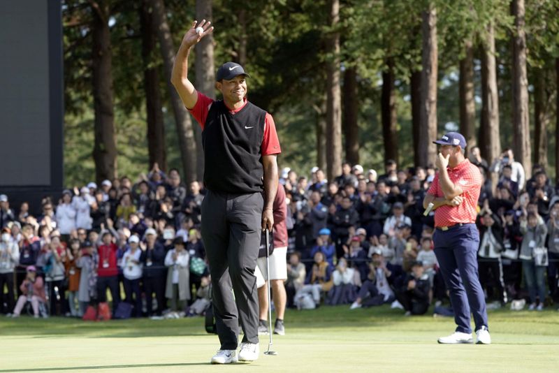 Tiger Woods celebrates to win the final round of the Zozo Championship, a PGA Tour event, at Narashino Country Club in Inzai, Japan
