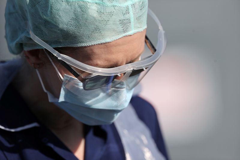 FILE PHOTO: A member of medical staff is seen at an NHS coronavirus disease (COVID-19) testing facility, Wolverhampton