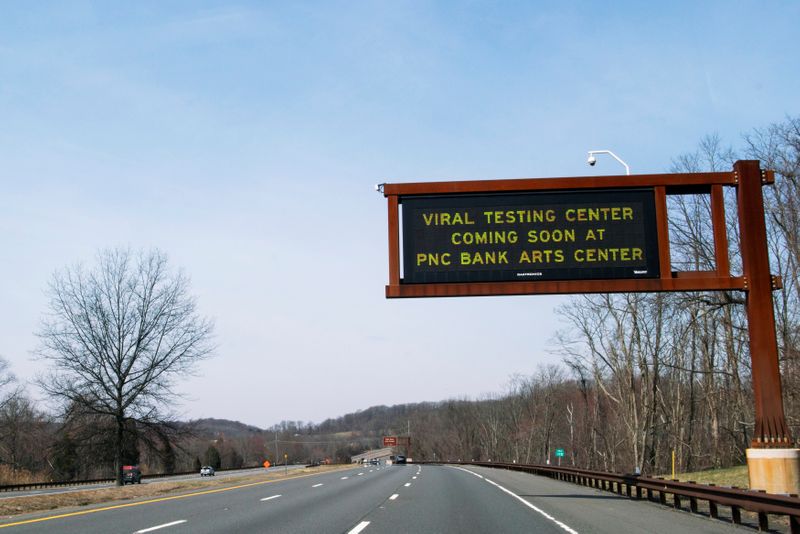 Roadside screen gives information about testing center for coronavirus disease (COVID-19), in Holmdel, NJ