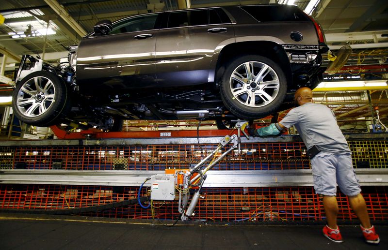 FILE PHOTO: Mike Guillen works on the assembly line at the General Motors Assembly Plant in Arlington, Texas