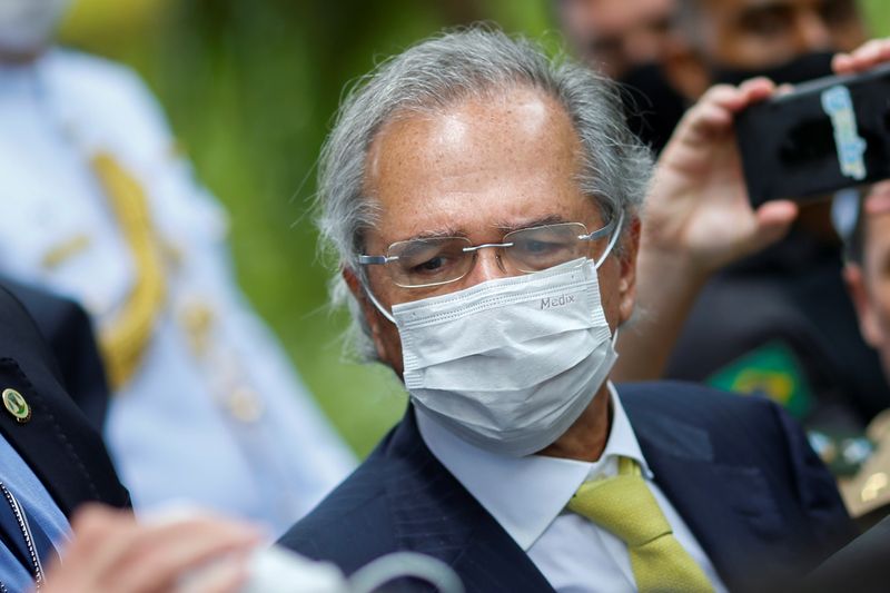 FILE PHOTO: Brazil's Economy Minister Paulo Guedes wears a protective mask during a news conference after a meeting with President of Brazil's Supreme Federal Court Dias Toffoli, amid the coronavirus disease (COVID-19) outbreak in Brasilia