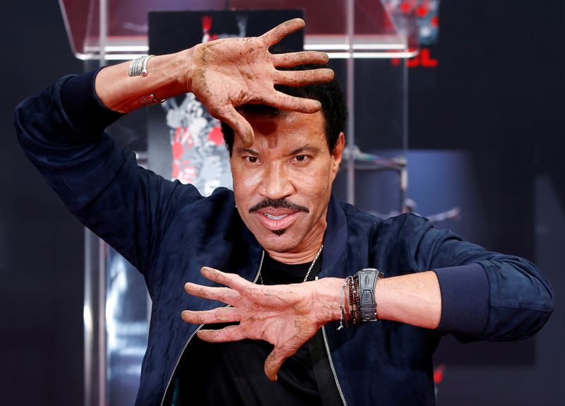FILE PHOTO: Recording artist Richie shows his hands after placing them in cement during a ceremony in the forecourt of the TCL Chinese theatre in Los Angeles