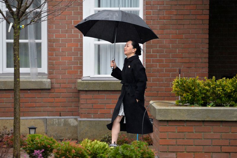 FILE PHOTO: Huawei Chief Financial Officer Meng Wanzhou leaves her home to attend her extradition hearing in Vancouver