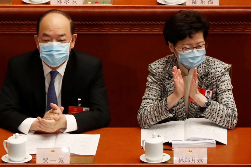 Hong Kong Chief Executive Carrie Lam and Macau Chief Executive Ho Iat-seng attend the opening session of NPC in Beijing