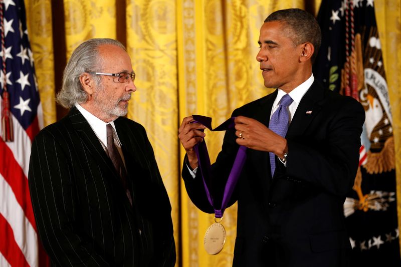 FILE PHOTO: U.S. President Barack Obama awards the 2012 National Medal of Arts to musician Herb Alpert during a ceremony in Washington