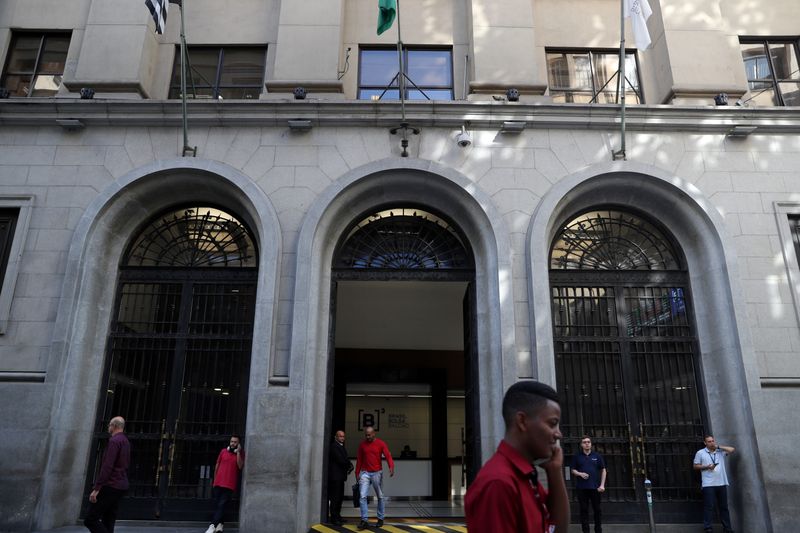 People walk past Brazil's B3 Stock Exchange building in downtown Sao Paulo