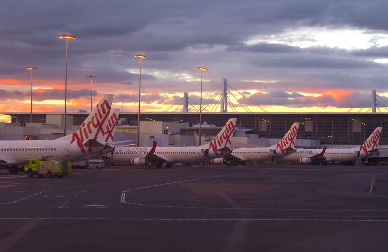 FILE PHOTO: Aircraft from Australia's second largest airline, Virgin Australia, sit on the tarmac at the domestic terminal of Sydney Airport