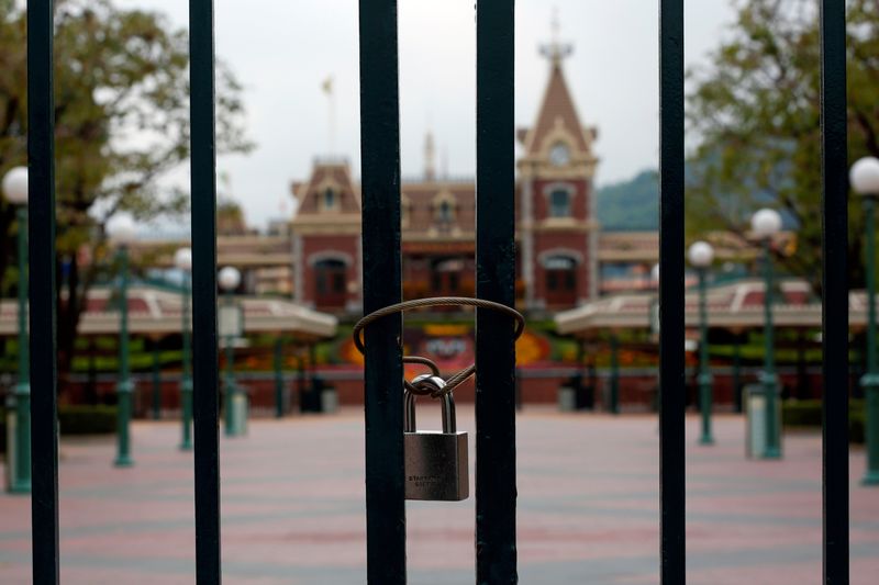 FILE PHOTO: A locked gate is seen after the Hong Kong Disneyland theme park closed due to the coronavirus outbreak