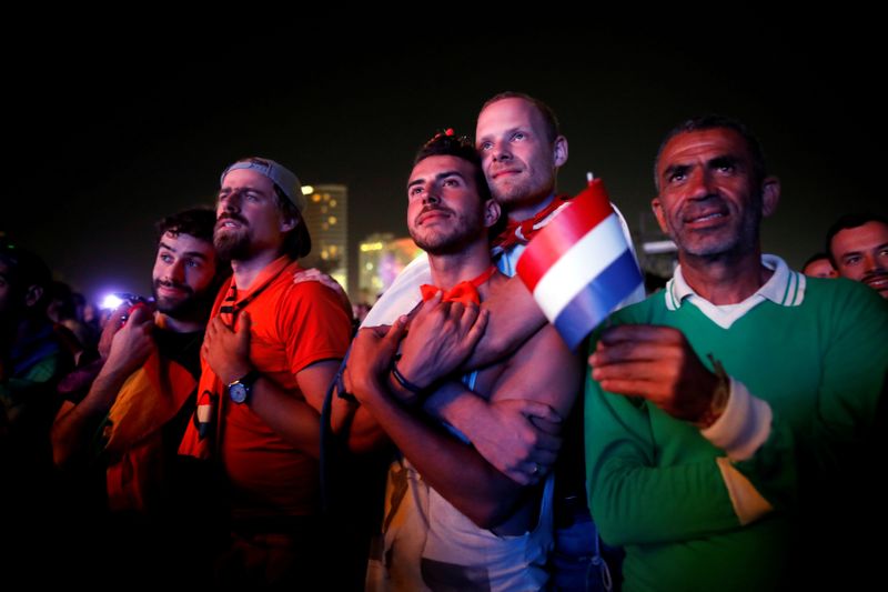FILE PHOTO: Fans watch on a big screen the 2019 Eurovision song contest final in the fans zone by the beach in Tel Aviv, Israel
