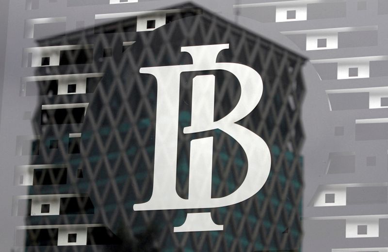 FILE PHOTO: The logo of Indonesia's central bank, Bank Indonesia, is seen on a window in the bank's lobby in Jakarta