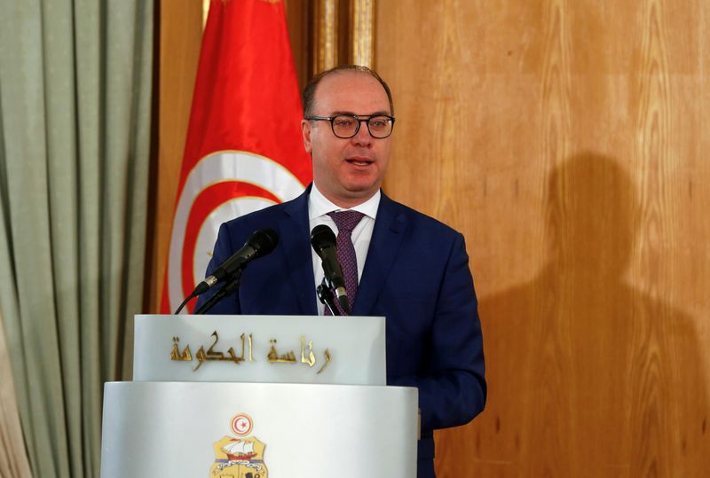 FILE PHOTO: Tunisian Prime Minister Elyes Fakhfakh speaks during a handover ceremony in Tunis