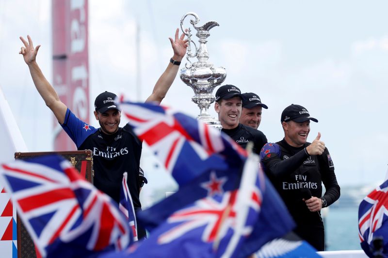 FILE PHOTO: mirates Team New Zealand celebrates with the America's Cup trophy in 2017 after defeating Oracle Team USA
