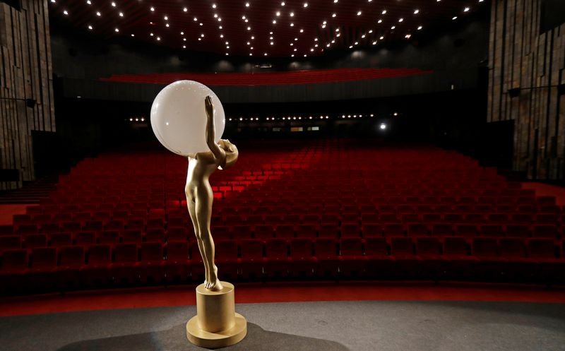 A statue of the Crystal Globe Award is seen inside an empty cinema in Karlovy Vary