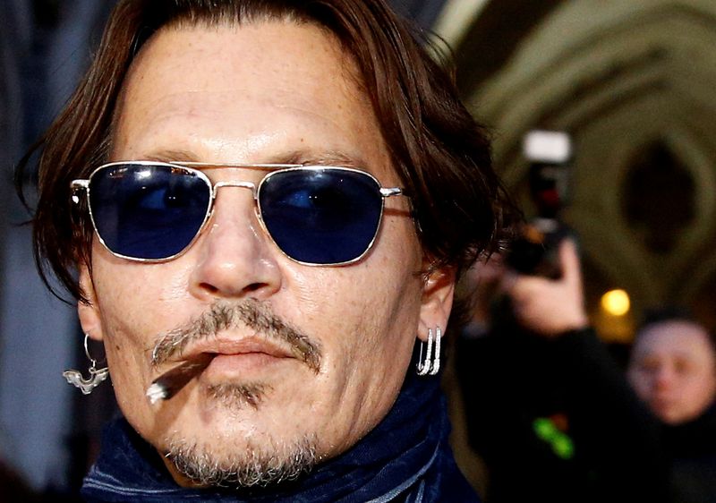 FILE PHOTO: Actor Johnny Depp leaves the High Court in London