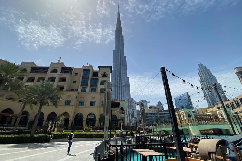 FILE PHOTO: People walk outside Dubai mall after the UAE government eased a curfew and allowed stores to open, following the outbreak of the coronavirus disease (COVID-19) in Dubai