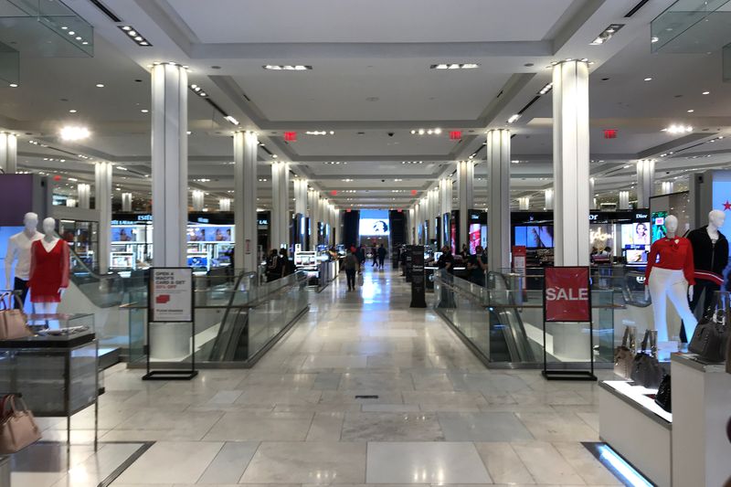 FILE PHOTO: People shop at Macy's Herald Square store on the first day of the phase two re-opening of businesses following the outbreak of the coronavirus disease (COVID-19), in the Manhattan borough of New York City