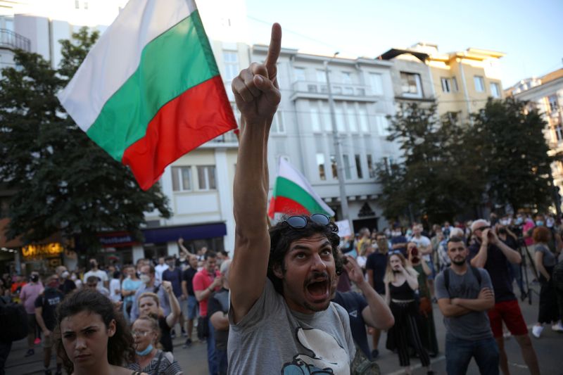 FILE PHOTO: People take part in a demonstration after prosecutors raided Bulgarian president's offices as part of investigations in Sofia