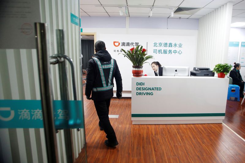 FILE PHOTO: Substitute driver arrives for a training session at Didi Chuxing's Designated Driving office in Beijing