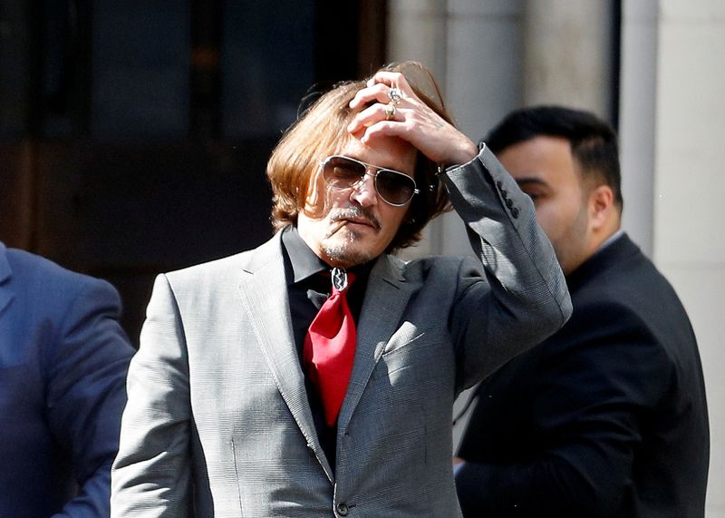 FILE PHOTO: Actors Johnny Depp and Amber Heard at the High Court in London