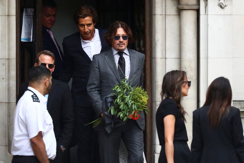 Actors Amber Heard and Johnny Depp at the High Court in London