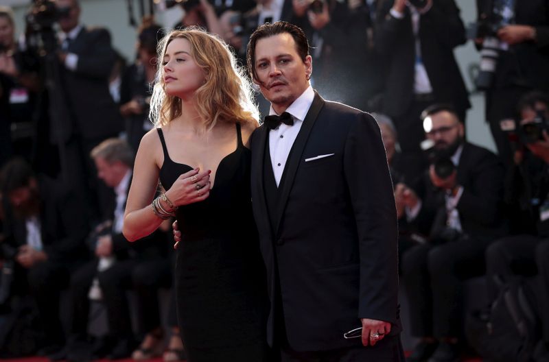 FILE PHOTO: Actor Depp and his wife Heard attend the red carpet event for the movie