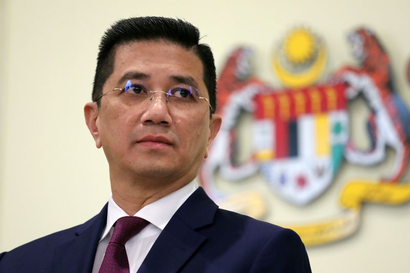 FILE PHOTO: Malaysia's Minister of International Trade and Industry Azmin Ali reacts during a news conference in Putrajaya