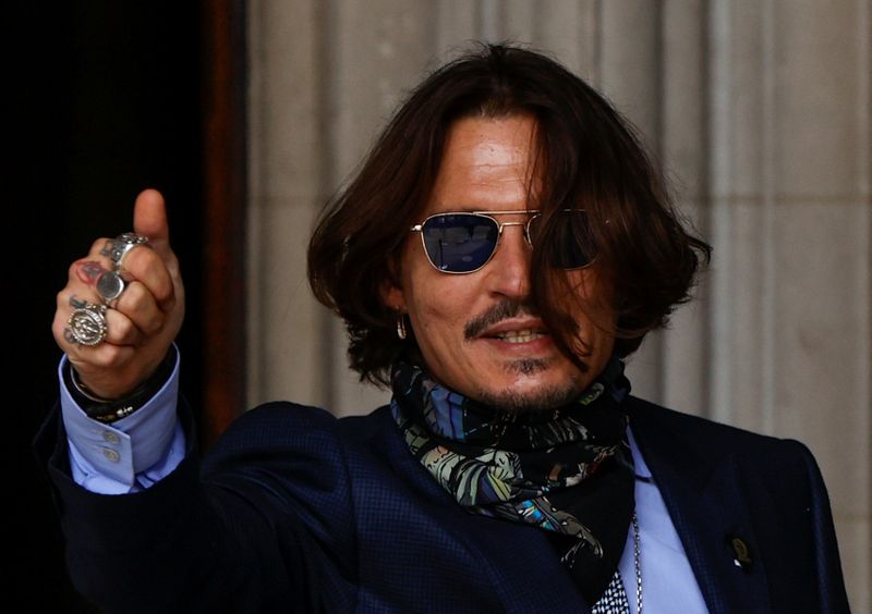 FILE PHOTO: Actors Johnny Depp and Amber Heard at the High Court in London