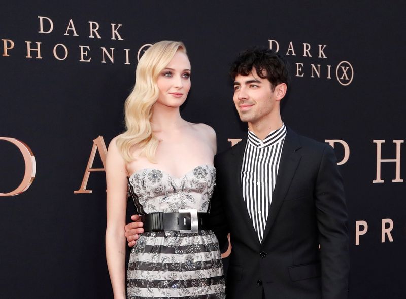 FILE PHOTO: Actor Sophie Turner poses with her husband Joe Jonas at the premiere for the film