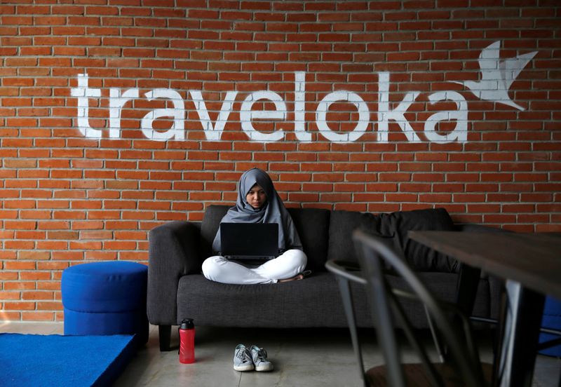 An employee of Traveloka works at the company's headquarters in Jakarta