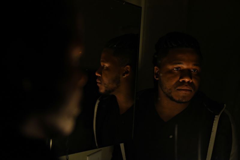 Tristan Jackson-Stankunas poses for a portrait at his apartment in Austinu000d