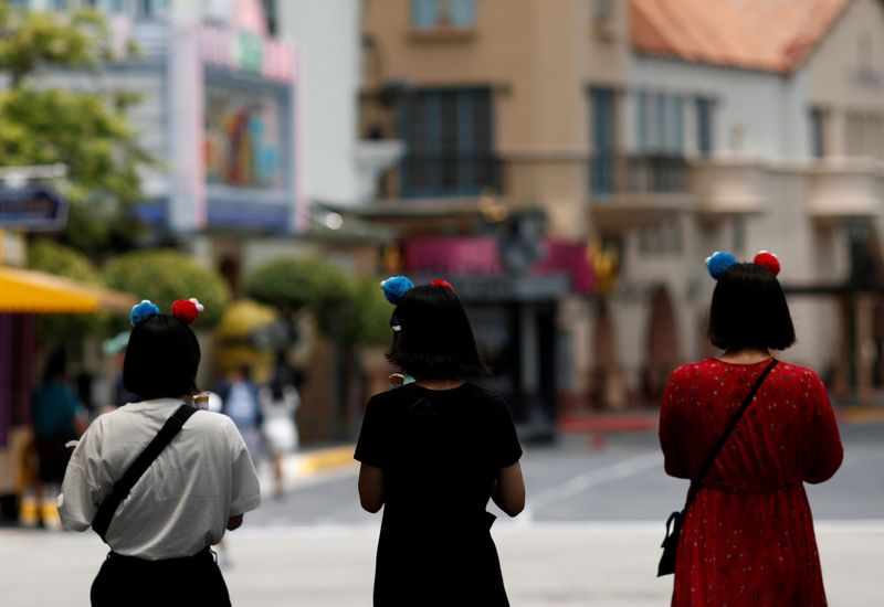 FILE PHOTO: People visit the largely empty Universal Studios Singapore, as tourism takes a decline following the coronavirus outbreak, in Sentosa