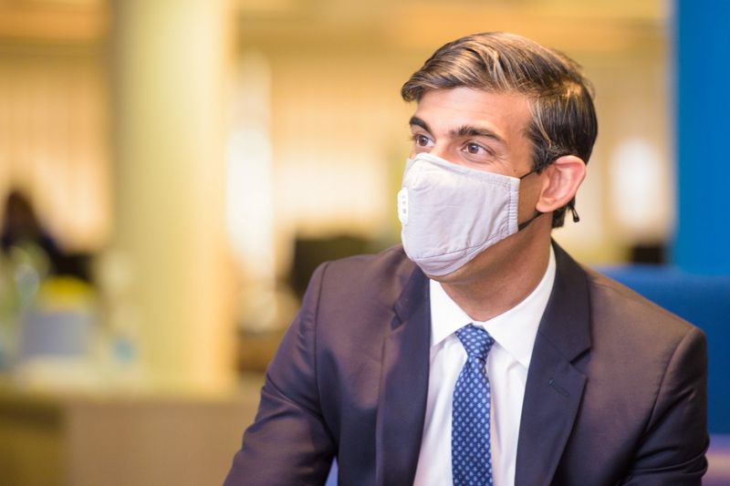 FILE PHOTO: Britain's Chancellor of the Exchequer Rishi Sunak visits the Jobcentre Plus in east London